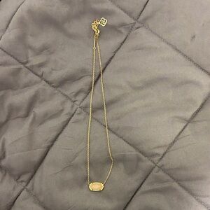 Elegant Gold Necklace with Cream Pendant